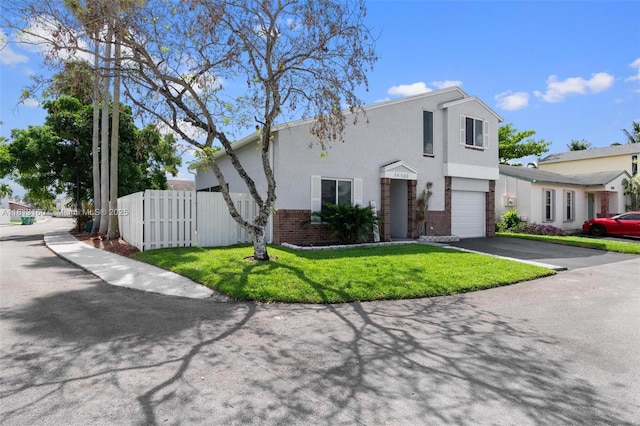 14100 Langley Pl, Davie, FL 33325 - view of front facade featuring a garage, asphalt driveway, stucco siding, and brick siding