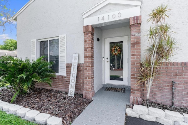 14100 Langley Pl, Davie, FL 33325 - doorway to property with stucco siding and brick siding