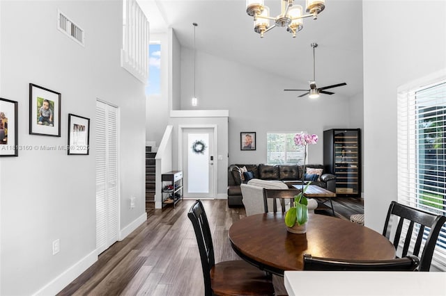 14100 Langley Pl, Davie, FL 33325 - dining area featuring high vaulted ceiling, wood finished floors, a chandelier, baseboards, and a ceiling fan