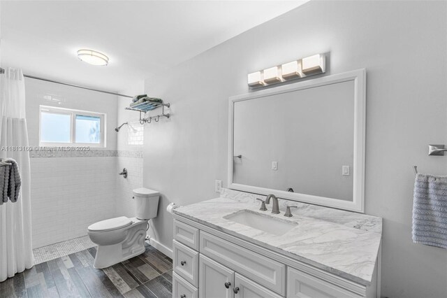 14100 Langley Pl, Davie, FL 33325 - full bath with vanity, toilet, tiled shower, and wood finished floors