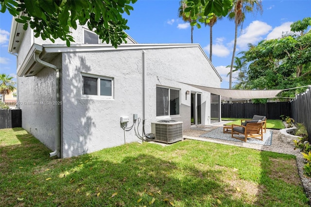14100 Langley Pl, Davie, FL 33325 - rear view of house featuring stucco siding, a patio, central AC unit, and outdoor lounge area