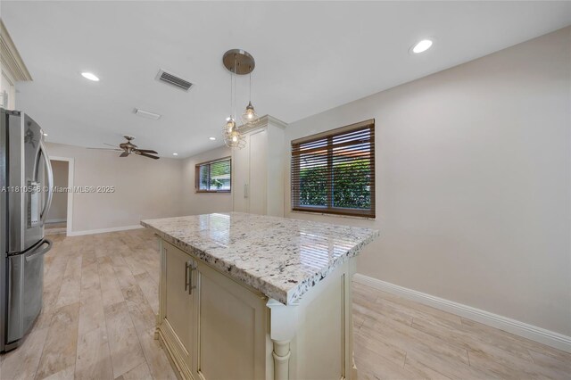 1237 Dove Ave, Miami Springs, FL 33166 - kitchen featuring stainless steel appliances, cream cabinetry, tasteful backsplash, light wood finished floors, and recessed lighting