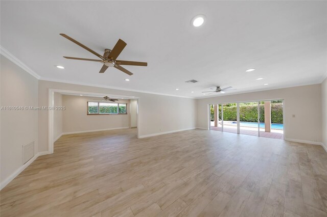 1237 Dove Ave, Miami Springs, FL 33166 - unfurnished living room featuring crown molding, a ceiling fan, recessed lighting, and light wood-style flooring