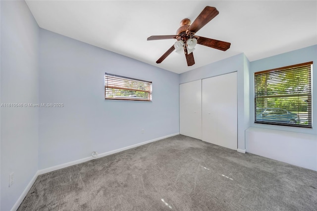 1237 Dove Ave, Miami Springs, FL 33166 - unfurnished bedroom with multiple windows, carpet, a closet, and a ceiling fan