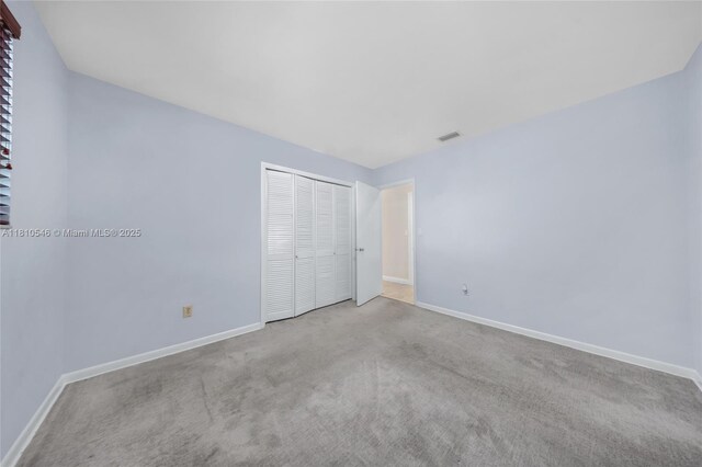 1237 Dove Ave, Miami Springs, FL 33166 - carpeted spare room featuring a ceiling fan and baseboards