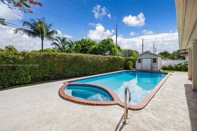 1237 Dove Ave, Miami Springs, FL 33166 - view of swimming pool with a ceiling fan, a storage shed, a fenced backyard, a patio area, and a wooden deck