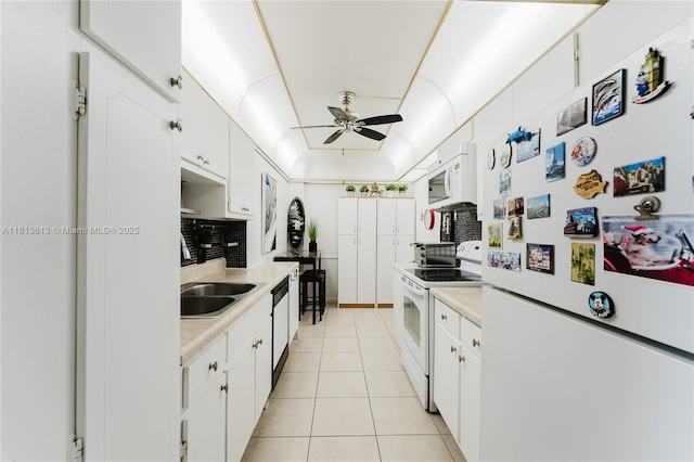 4330 Hillcrest Dr Unit 505, Hollywood, FL 33021 - kitchen with white appliances, ceiling fan, light countertops, and tasteful backsplash