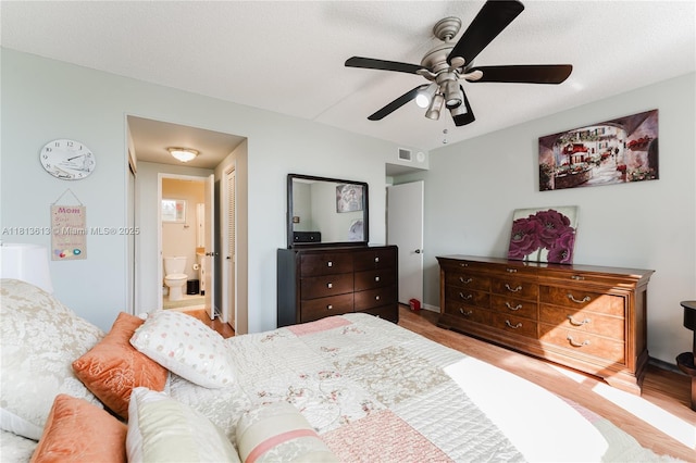 4330 Hillcrest Dr Unit 505, Hollywood, FL 33021 - bedroom with baseboards, a closet, ensuite bath, and ceiling fan