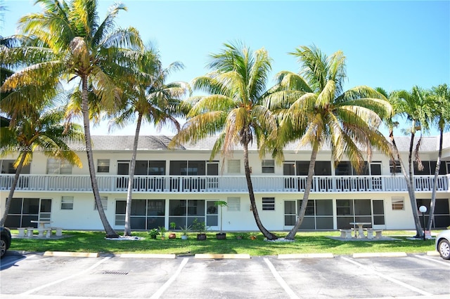 705 NE 2nd St Unit 4, Hallandale Beach, FL 33009 - view of building exterior featuring uncovered parking