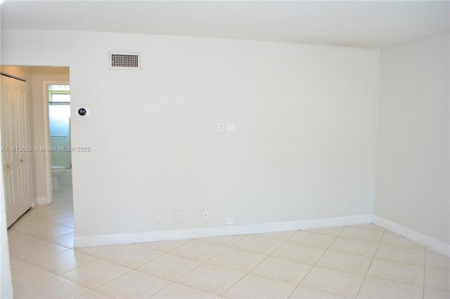 705 NE 2nd St Unit 4, Hallandale Beach, FL 33009 - spare room featuring baseboards and light tile patterned floors