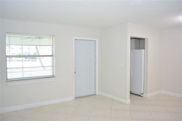 705 NE 2nd St Unit 4, Hallandale Beach, FL 33009 - unfurnished room with baseboards and light tile patterned floors