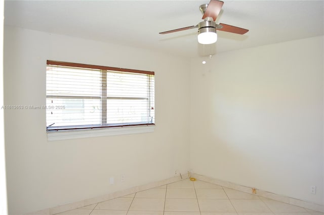 705 NE 2nd St Unit 4, Hallandale Beach, FL 33009 - unfurnished room with baseboards, a ceiling fan, and light tile patterned floors