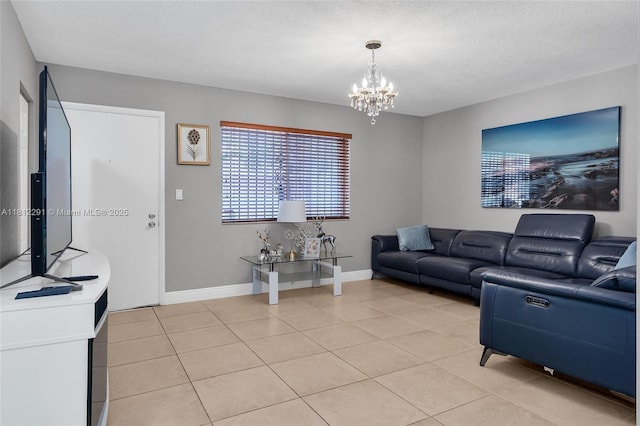 8401 SW 107th Ave Unit 117E, Miami, FL 33173 - living area with a chandelier, light tile patterned floors, baseboards, and a textured ceiling