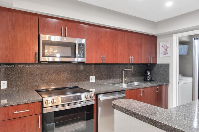 8401 SW 107th Ave Unit 117E, Miami, FL 33173 - kitchen with appliances with stainless steel finishes, a sink, tasteful backsplash, and dark countertops