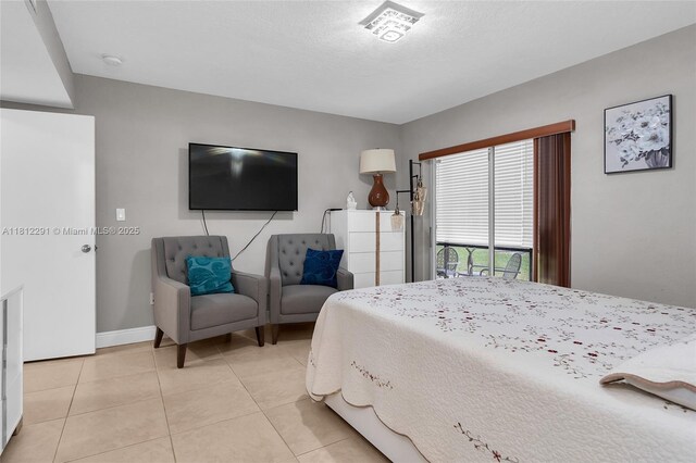 8401 SW 107th Ave Unit 117E, Miami, FL 33173 - bedroom featuring light tile patterned floors and baseboards