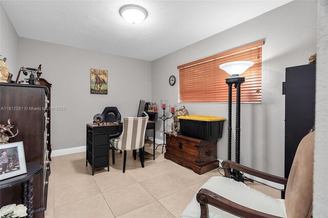 8401 SW 107th Ave Unit 117E, Miami, FL 33173 - home office featuring light tile patterned flooring and a textured ceiling