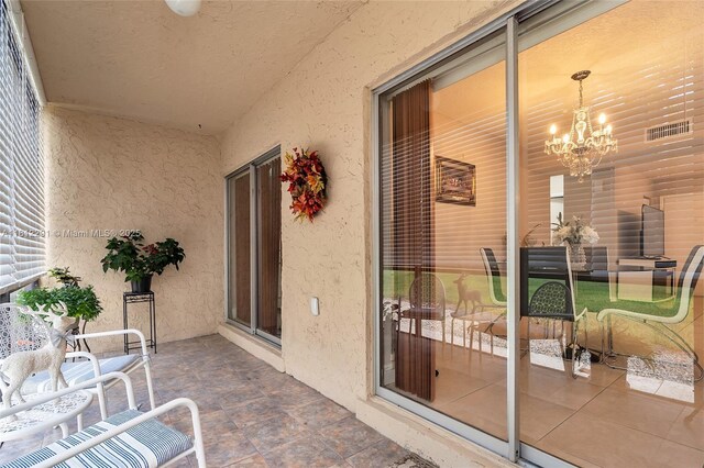 8401 SW 107th Ave Unit 117E, Miami, FL 33173 - sunroom / solarium featuring a chandelier