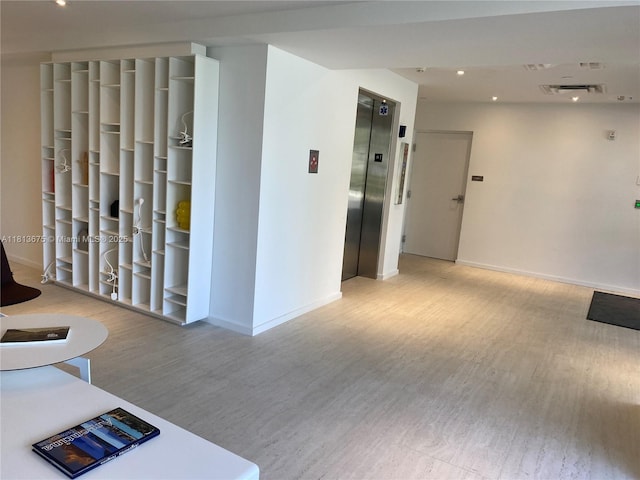 10250 Collins Ave Unit 211, Bal Harbour, FL 33154 - hall featuring elevator, wood finished floors, baseboards, and recessed lighting