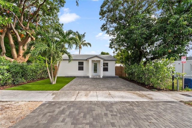 2374 NW 56th St, Miami, FL 33142 - ranch-style home featuring stucco siding and driveway