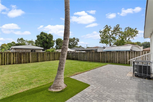 2374 NW 56th St, Miami, FL 33142 - view of yard featuring a patio and central air condition unit