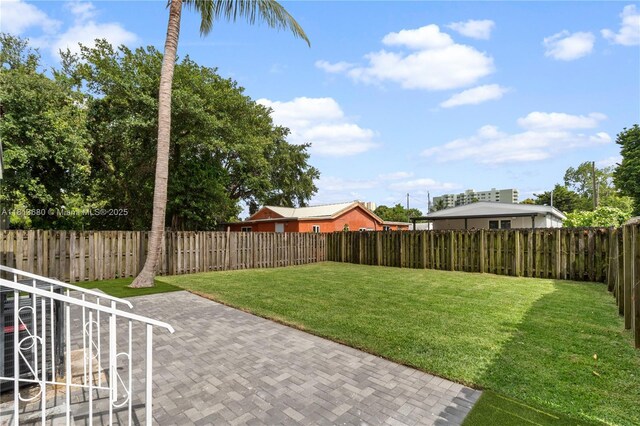2374 NW 56th St, Miami, FL 33142 - view of yard featuring a patio