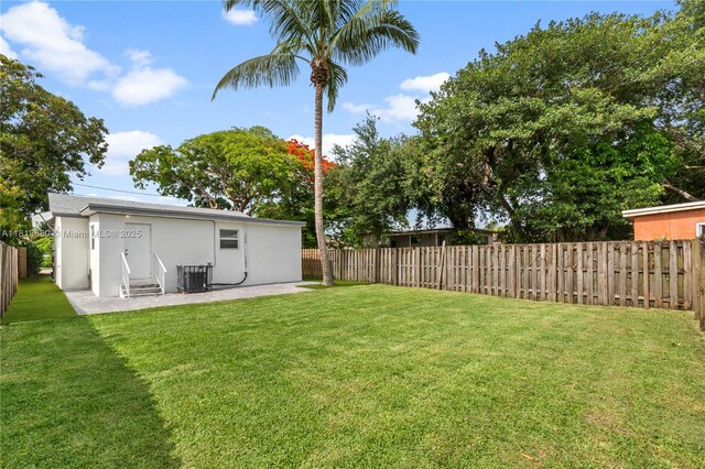 2374 NW 56th St, Miami, FL 33142 - view of yard with central AC unit and a patio