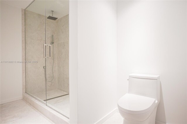 10250 Collins Ave Unit Ph1, Bal Harbour, FL 33154 - bathroom with a stall shower, toilet, and baseboards