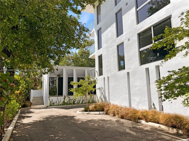 10250 Collins Ave Unit Ph1, Bal Harbour, FL 33154 - view of side of home with stucco siding