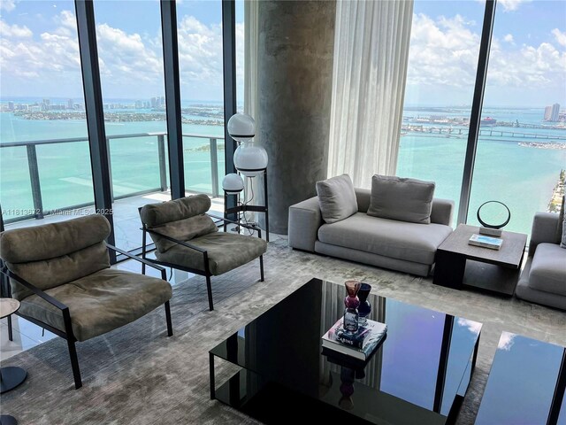 3131 NE 7th Ave Unit Ph4901, Miami, FL 33137 - living area featuring a water view, floor to ceiling windows, and a city view