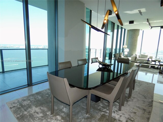 3131 NE 7th Ave Unit Ph4901, Miami, FL 33137 - dining space with expansive windows and a water view