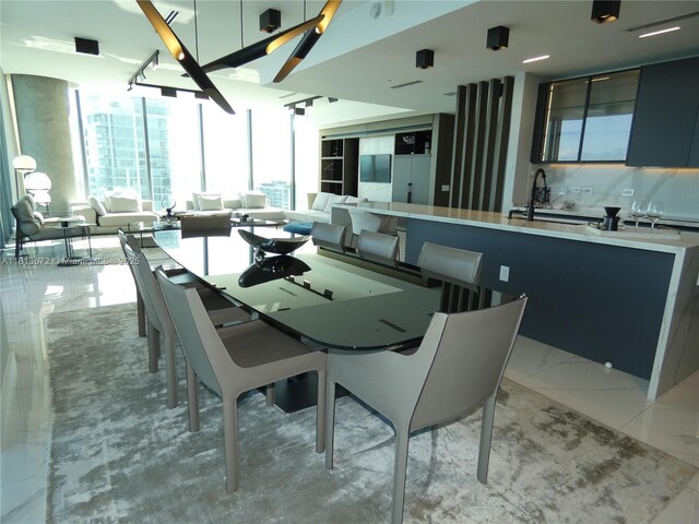 3131 NE 7th Ave Unit Ph4901, Miami, FL 33137 - dining room featuring floor to ceiling windows and light marble finish flooring