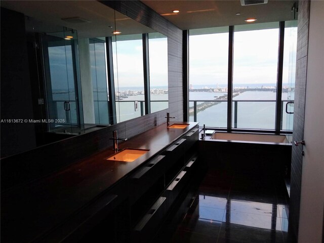 3131 NE 7th Ave Unit Ph4901, Miami, FL 33137 - hallway featuring a sink and a water view