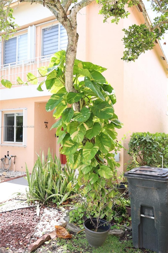 20816 NW 2nd St, Pembroke Pines, FL 33029 - view of side of property featuring stucco siding and a balcony
