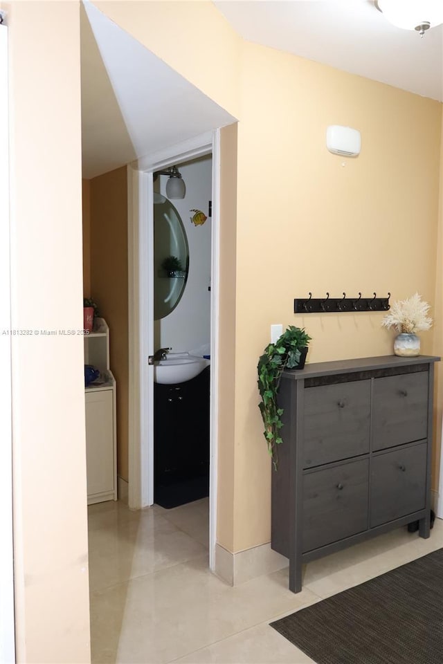 20816 NW 2nd St, Pembroke Pines, FL 33029 - hall featuring a sink and light tile patterned floors