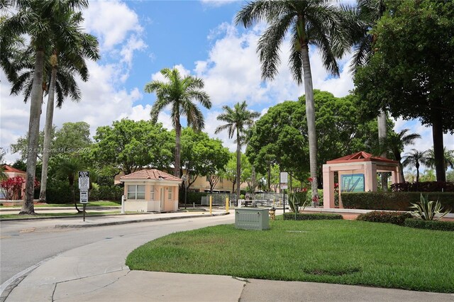 20816 NW 2nd St, Pembroke Pines, FL 33029 - view of asphalt road with sidewalks, traffic signs, and curbs