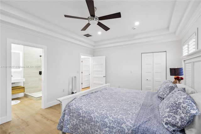 3229 Canal Dr, Pompano Beach, FL 33062 - bedroom featuring a tray ceiling, light wood-style floors, recessed lighting, a ceiling fan, and ensuite bath