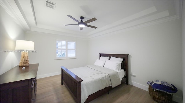 3229 Canal Dr, Pompano Beach, FL 33062 - bedroom featuring a raised ceiling, wood finished floors, ceiling fan, and ornamental molding