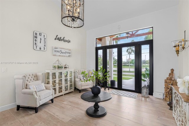 9291 SW 88th St, Miami, FL 33176 - entrance foyer with a chandelier, wood finished floors, and a towering ceiling
