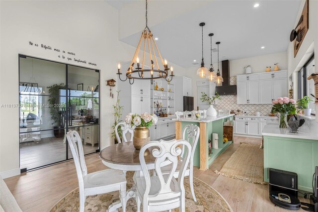 9291 SW 88th St, Miami, FL 33176 - dining room with a chandelier, light wood finished floors, high vaulted ceiling, and recessed lighting