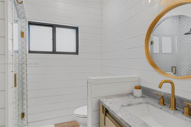 9291 SW 88th St, Miami, FL 33176 - bathroom with toilet, vanity, a shower with shower door, and wood walls
