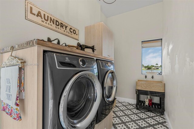 9291 SW 88th St, Miami, FL 33176 - laundry room featuring washing machine and dryer, cabinet space, light floors, and baseboards