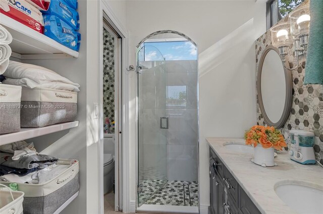 9291 SW 88th St, Miami, FL 33176 - bathroom featuring toilet, a stall shower, and double vanity