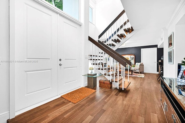 1450 Ortega Ave, Coral Gables, FL 33134 - foyer with stairs, wood finished floors, and crown molding