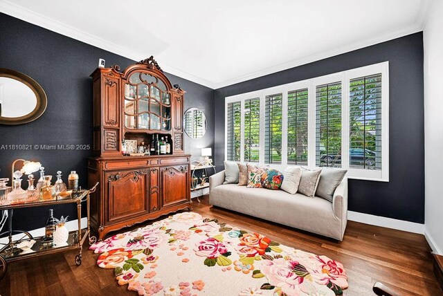 1450 Ortega Ave, Coral Gables, FL 33134 - living area with crown molding, wood finished floors, and baseboards