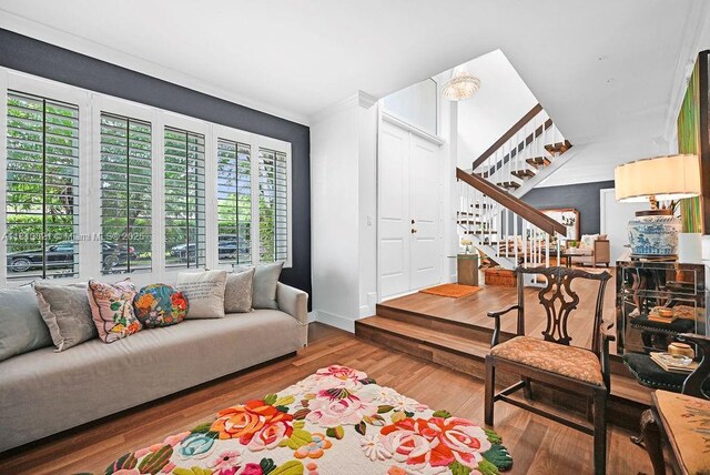 1450 Ortega Ave, Coral Gables, FL 33134 - living area with stairs, wood finished floors, ornamental molding, and baseboards