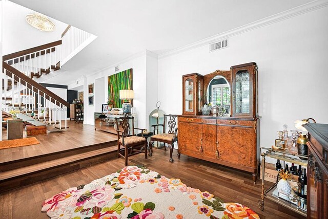 1450 Ortega Ave, Coral Gables, FL 33134 - foyer entrance with ornamental molding, stairway, and wood finished floors