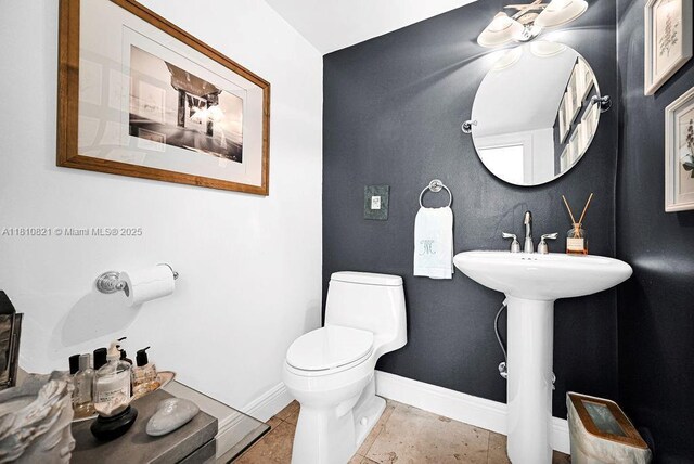 1450 Ortega Ave, Coral Gables, FL 33134 - half bathroom featuring toilet and baseboards