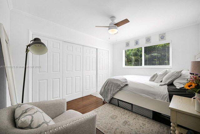 1450 Ortega Ave, Coral Gables, FL 33134 - bedroom with wood finished floors, a closet, crown molding, and ceiling fan