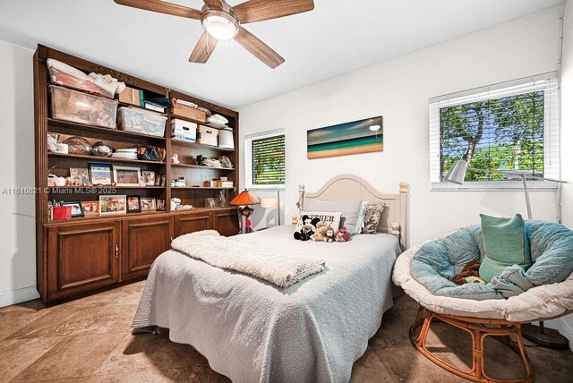 1450 Ortega Ave, Coral Gables, FL 33134 - bedroom with a ceiling fan and light stone finish floors