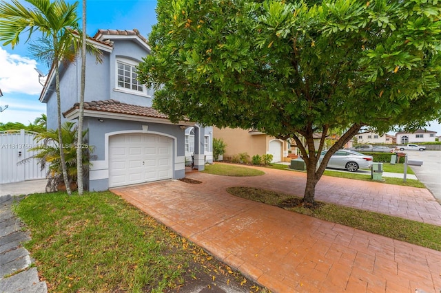 14011 SW 151st Ave, Miami, FL 33196 - view of front of property featuring decorative driveway, a tile roof, stucco siding, and a garage